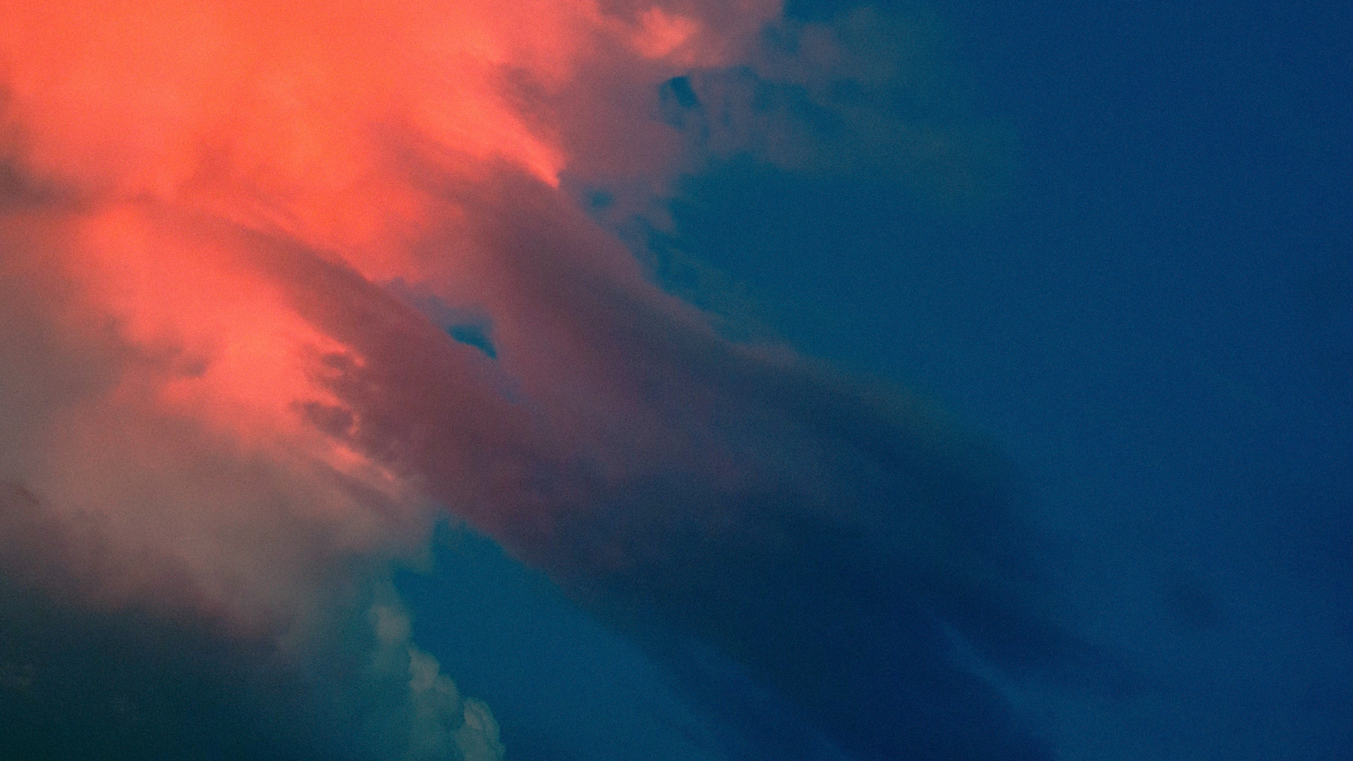 a pink/violet cloud in the sky